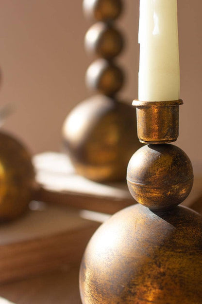 SET OF THREE ANTIQUE BRASS TAPER CANDLE HOLDERS: Gold / Metal / Large: 4"d x 11.5"t; Medium: 4"d x 8.5"t; Small: 4"d x 6.5"t